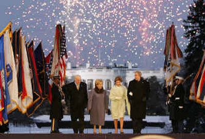 
President George W. Bush, with first lady Laura Bush, Vice President Dick Cheney and Lynne Cheney, walk on stage at Wednesday's Celebration of Freedom inaugural party. 
 (EPA / The Spokesman-Review)