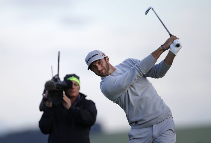 Dustin Johnson, teeing off from the seventh hole, struggled in the wind and rain during his incompleted second round. (Associated Press)
