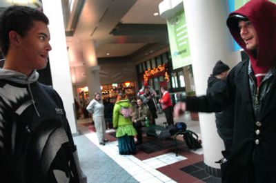 
Brandon Elder, 18, left, chats with friend Mike Townsend at the STA Plaza in Spokane on Friday. Elder was enrolled at Ferris High School last year and was also taken frequently to the Spokane Community Truancy Center. 
 (photos by Holly Pickett / The Spokesman-Review)