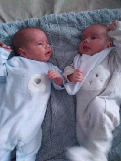 Identical twins Nicholas Alexander, left,  and Adam Thomas Hval  are wearing different outfits so mom and dad can tell them apart. (Cindy Hval / The Spokesman-Review)