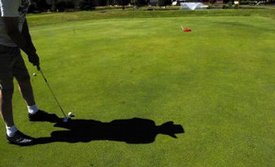 John Landers of Coeur d'Alene attempts a putt at Ponderosa Springs. 
 (Kathy Plonka / The Spokesman-Review)