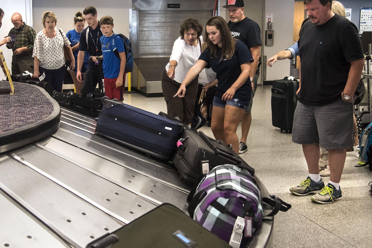 Delta passengers from Salt Lake City identify their luggage at the Spokane International Airport baggage claim on Tuesday. Airport officials are talking about a $110 million program to update airport facilities, including having a new central baggage claim area. (Dan Pelle / The Spokesman-Review)