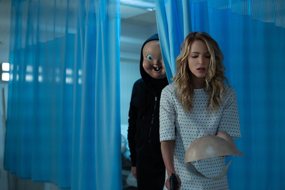Jessica Rothe with “Babyface” in the horror sequel “Happy Death Day 2U.” (Michele K. Short / Universal Studios)