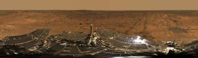 
This composite file photo released by NASA was created by combining hundreds of images taken by the panoramic camera on NASA's Mars exploration rover Spirit  from Aug. 24  to Aug. 27, 2005, and made into a 360-degree view called 