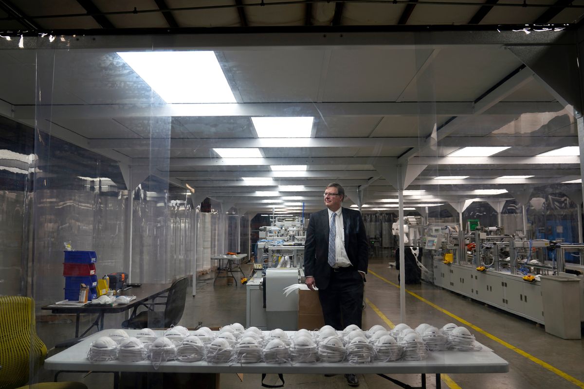 Jim Schmersahl, owner of Halcyon Shades, poses in a "clean room" used in making N-95 masks at the company