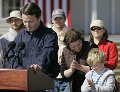 
John Edwards announces his withdrawal from the presidential race Wednesday in the Hurricane Katrina-stricken Ninth Ward of New Orleans  as his wife, Elizabeth, and son Jack applaud. 
 (Associated Press / The Spokesman-Review)