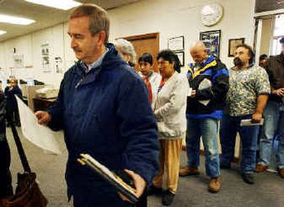 
Workers in North Carolina line up to collect unemployment benefits. 
 (Associated Press / The Spokesman-Review)