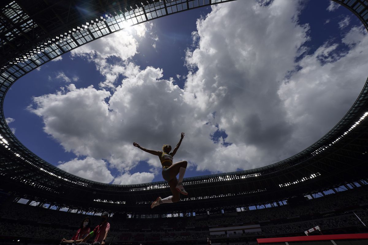 Malaika Mihambo, of Germany, competes in the women’s long jump final at the Summer Olympics today in Tokyo.  (David J. Phillip/Associated Press)
