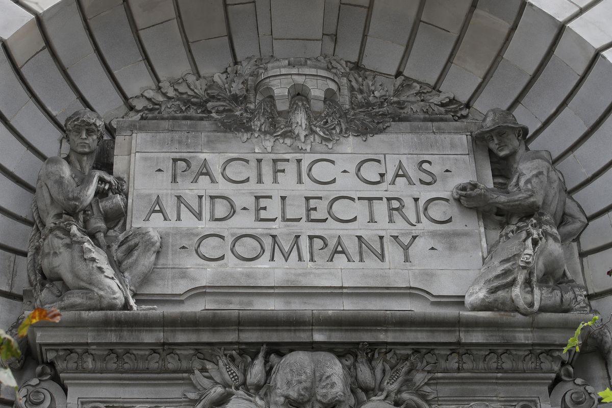 FILE - In this April 16, 2020, file photo, a Pacific Gas & Electric sign is displayed on the exterior of a PG&E building in San Francisco. Pacific Gas & Electric officials are to be expected to appear in court Tuesday, June 16, 2020, to plead guilty for the deadly wildfire that nearly wiped out the Northern California town of Paradise in 2018.  (Jeff Chiu)