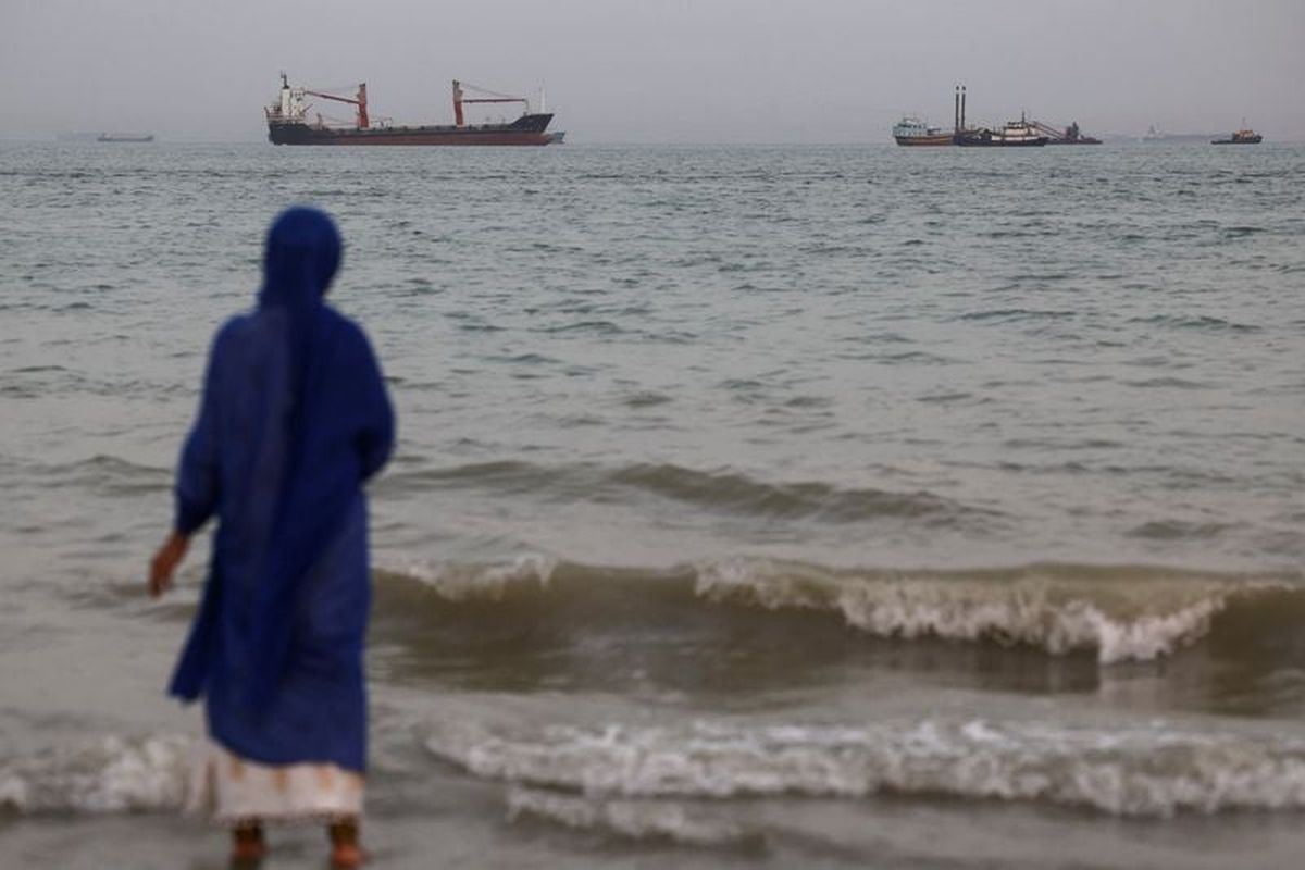 Vessels in the Strait of Hormuz are visible near the beach of Bandar Abbas, Iran, Friday. (Reuters )