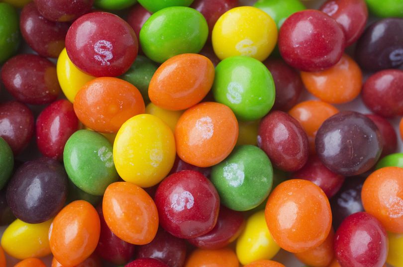 This June 1, 2016, file photo shows Skittles in New York. Skittles has temporarily ditched its rainbow theme in favor of an all-white look in the United Kingdom and Germany in order to celebrate LGBT pride. (Mark Lennihan / Associated Press)