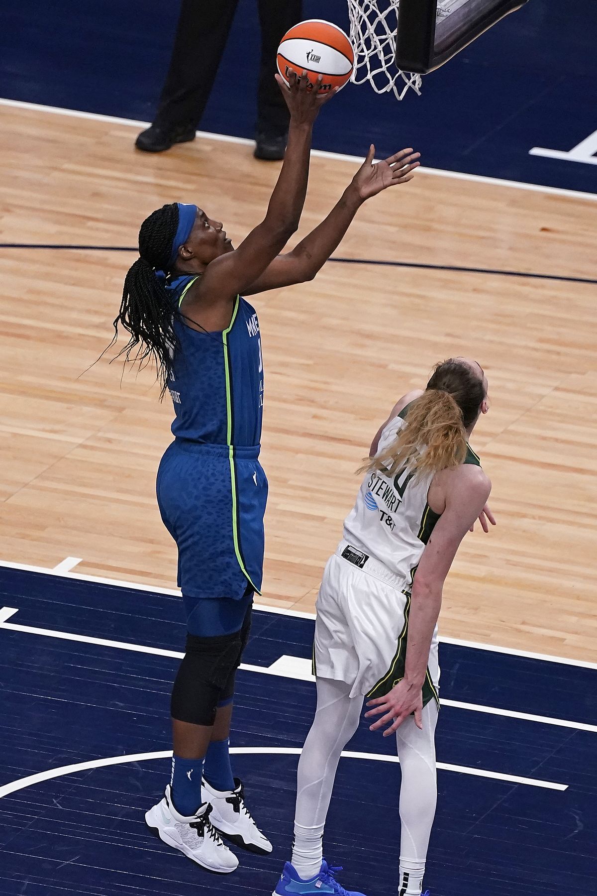 Minnesota Lynx center Sylvia Fowles (34) scorea against Seattle Storm forward Breanna Stewart (30) during the first quarter of a WNBA basketball game Thursday, May 20, 2021, in Minneapolis.  (Associated Press)