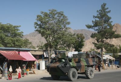 A French armored vehicle heads toward the scene of a gun battle in Surobi, Afghanistan, on Tuesday in which 10 soldiers were killed.  (Associated Press / The Spokesman-Review)