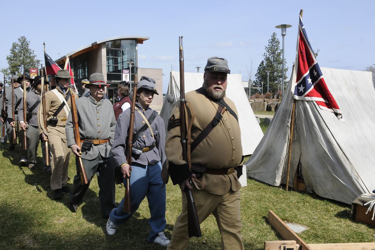 Members of the Washington Civil War Association 7th Tennessee Infantry Company G march back to their camp after a demonstration during Living History Day Saturday at the MAC in Spokane. (Dan Pelle)