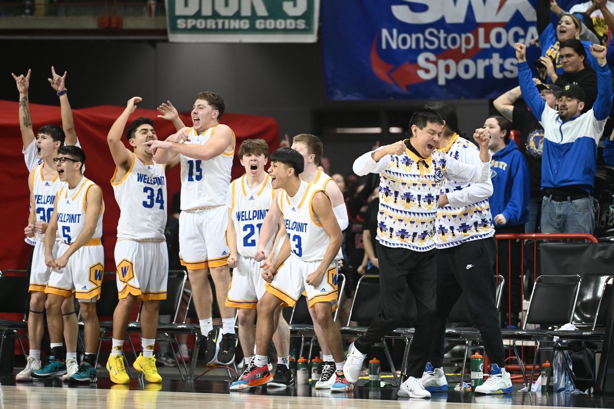 The Wellpinit Redskins basketball players celebrate as they pull ahead of the Mossyrock Vikings team Saturday, Mar. 2, 2024 at the Spokane Arena in the WIAA 1B boys basketball championship game.  (Jesse Tinsley/THE SPOKESMAN-REVI)
