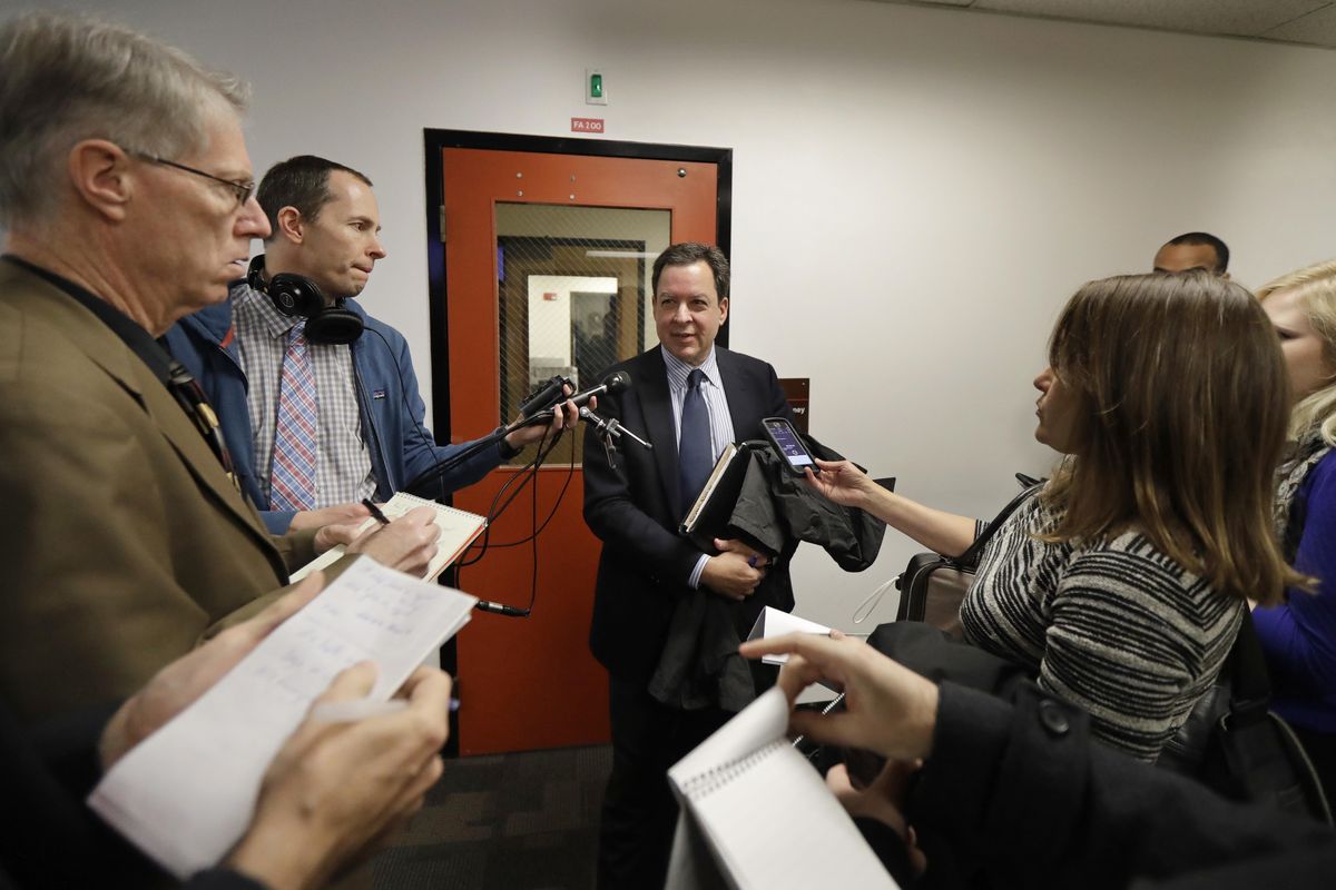 Paul Lawrence, center, an attorney for the Washington state Legislature, talks to reporters outside a Thurston County Superior courtroom, Friday, Jan. 19, 2018 in Olympia, Wash. (Ted S. Warren / AP)