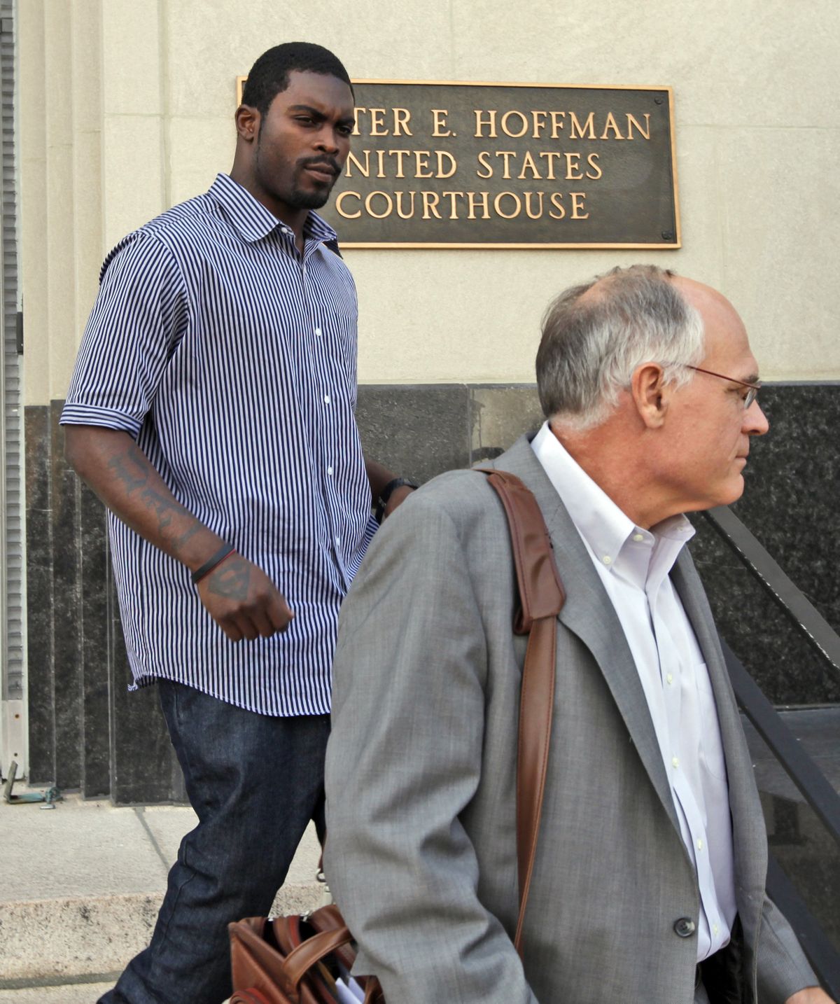 Michael Vick leaves federal court in Norfolk, Va., on Monday. (Associated Press / The Spokesman-Review)