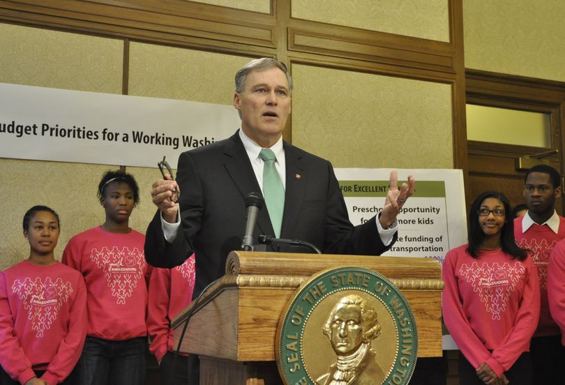 OLYMPIA -- With students from Seattle's Cleveland High School as a backdrop, Gov. Jay Inslee makes a pitch to close tax breaks and use the money to improve public schools. (Jim Camden)