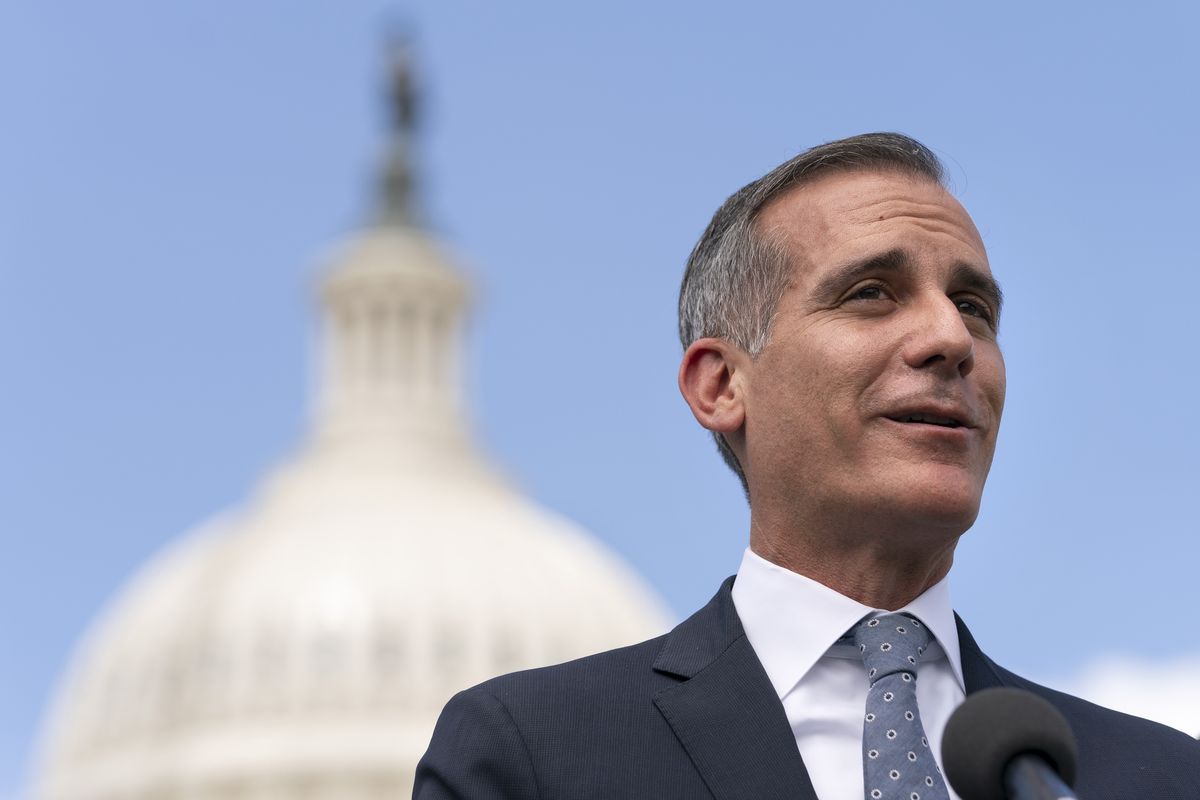 Los Angeles Mayor Eric Garcetti speaks during a news conference with House Transportation and Infrastructure Committee Chair Peter DeFazio, left, Wednesday, May 12, 2021, on Capitol Hill in Washington.  (Jacquelyn Martin)