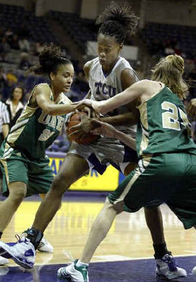 Sandora Irvin, center, of Texas Christian, tries to hold on to the rebound against Alabama-Birmingham's Carmen Guzman (22) and Katie Billue.
(Associated Press / The Spokesman-Review)