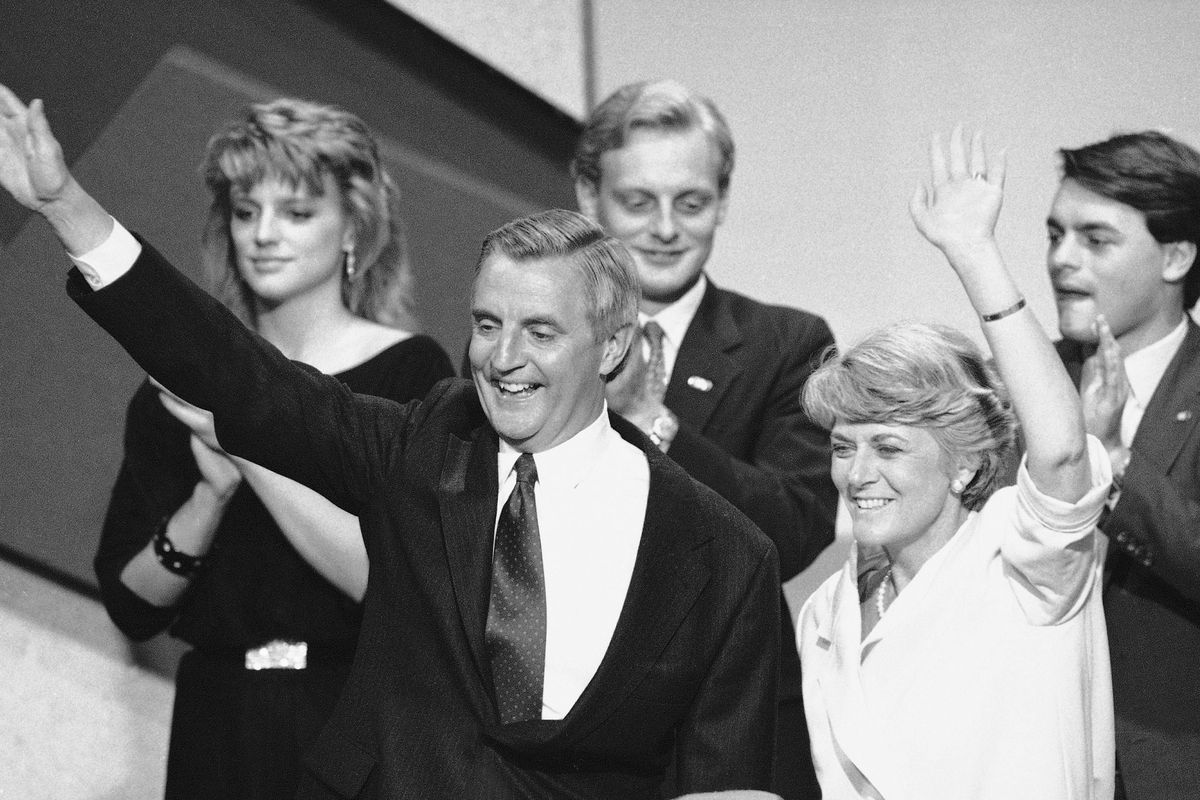 FILE - In this Thursday, July 19, 1984 file picture, Democratic presidential nominee Walter Mondale, center, and his running mate Geraldine Ferraro, right, wave from the podium at the conclusion of the final session of the Democratic National Convention in San Francisco, Calif.  In background are Mondale