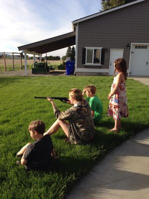 Olympian Amanda Furrer shoots a BB gun with her niece and nephews near the family's Spokane home on  May 21, 2014. (courtesy)
