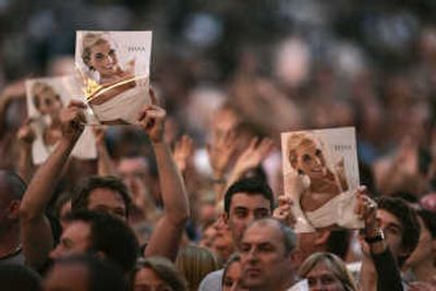 
The crowd waves posters of Princess Diana during the Concert for Diana at Wembley Stadium in London on Sunday, which would have been Diana's 46th birthday.Associated Press photos
 (Associated Press photos / The Spokesman-Review)