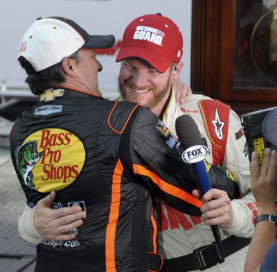 Winner Dale Earnhardt Jr., right, gets a hug from Tony Stewart. (Associated Press)