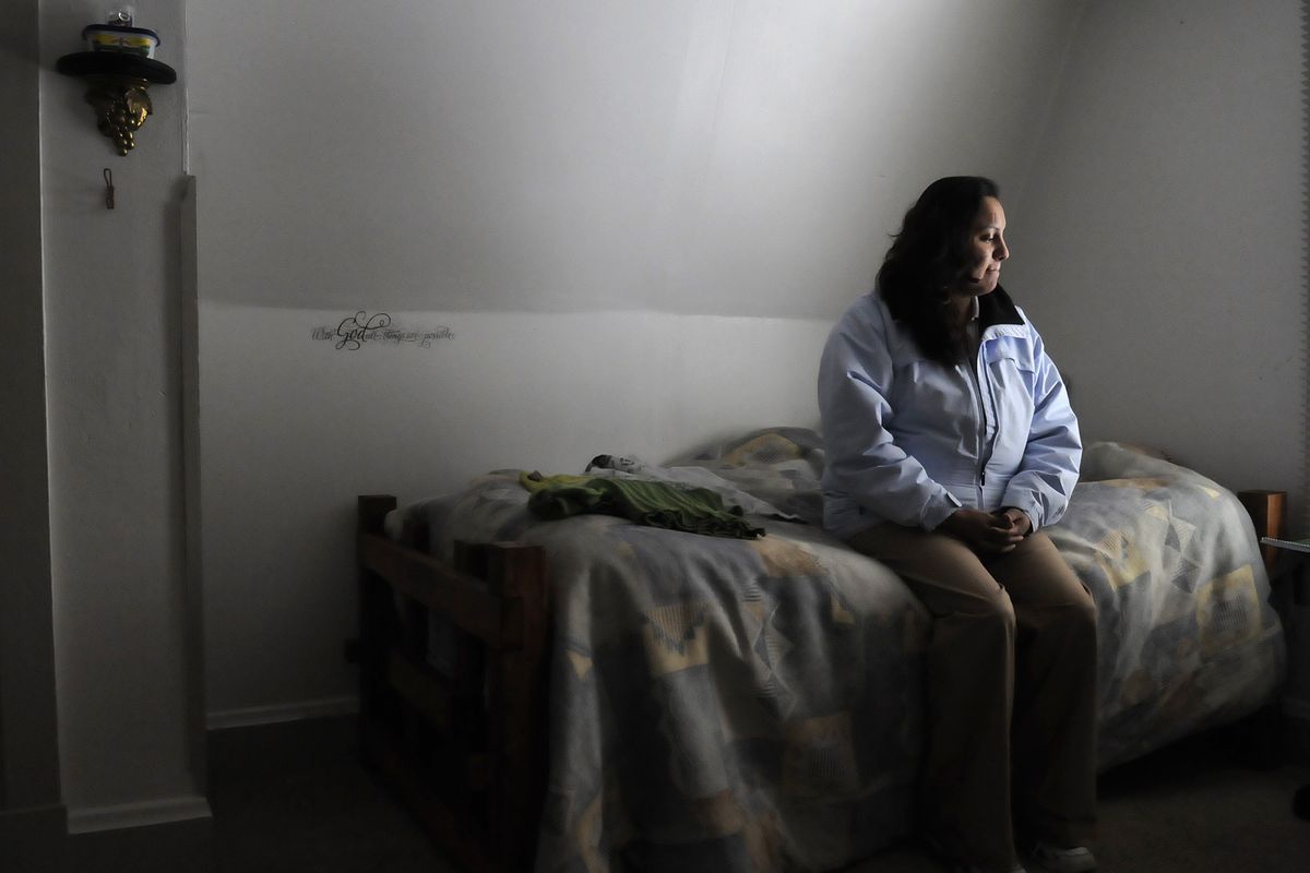 Ashlee Erickson, who recently moved into the Lighthouse of Hope house in Spokane’s West Central neighborhood, sits on her bed there Monday. The home serves as a transitional shelter for single women.  Erickson was recently released from prison. (PHOTOS BY JESSE TINSLEY)