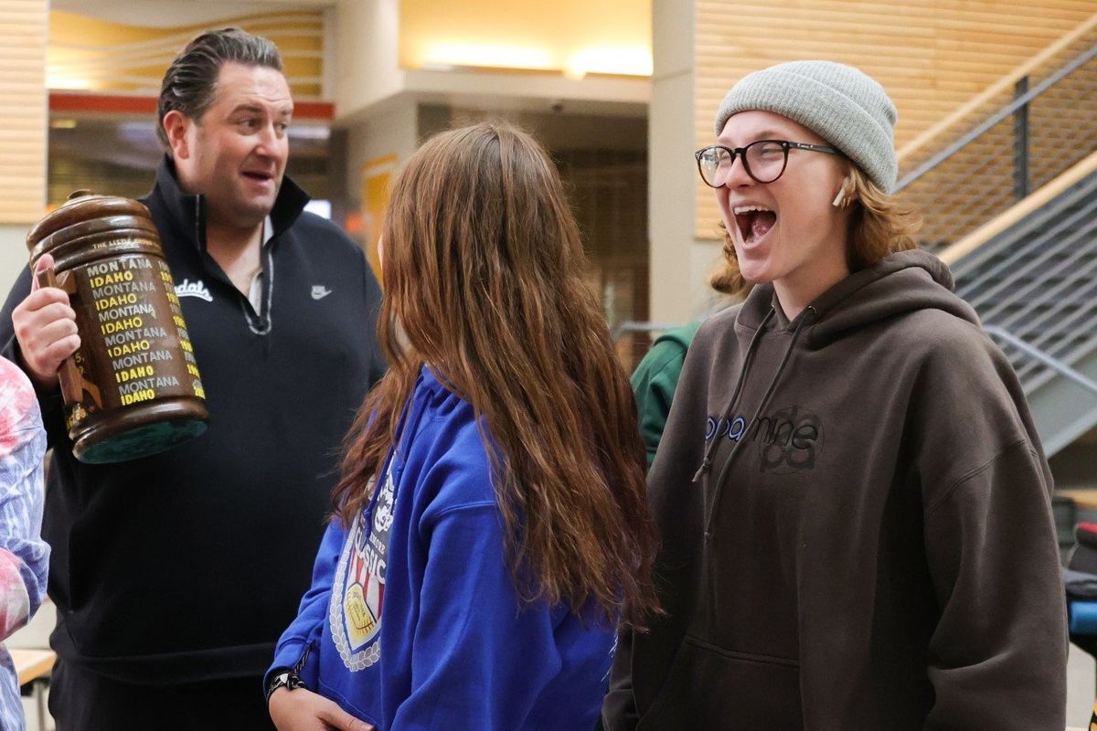 Coach Jason Eck shows off the Little Brown Stein to Idaho students on Wednesday in Moscow. The trophy is awarded to the winner of the Idaho-Montana football game each year.  (Courtesy of Idaho athletics)