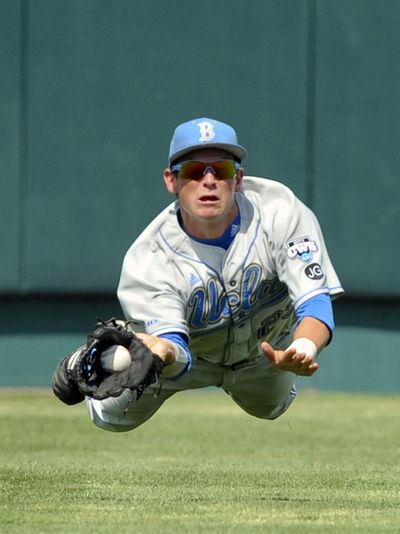 UCLA center fielder Beau Amaral makes a diving catch during TCU’s 6-2 win over UCLA at the College World Series.  (Associated Press)