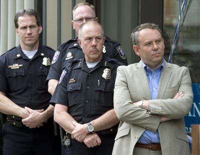 FILE - Spokane police including Joe Walker, left, Brad Arleth, Chief Frank Straub and Mayor David Condon at the opening of the new police facility net to the STA Plaza in June 2013. (Dan Pelle / The Spokesman-Review)