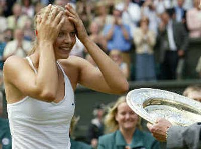
Russia's Maria Sharapova seems to find it hard to believe she won the Wimbledon women's singles title. 
 (Associated Press / The Spokesman-Review)