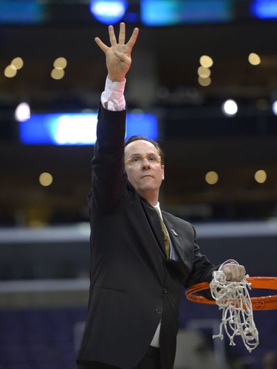 Wichita State coach Gregg Marshall signals that his team is headed to the Final Four. (Associated Press)