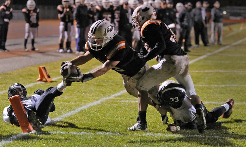 West Valley’s Dylan Ellsworth dives into the end zone for an Eagles touchdown in the second quarter Thursday night at West Valley. (Colin Mulvany)