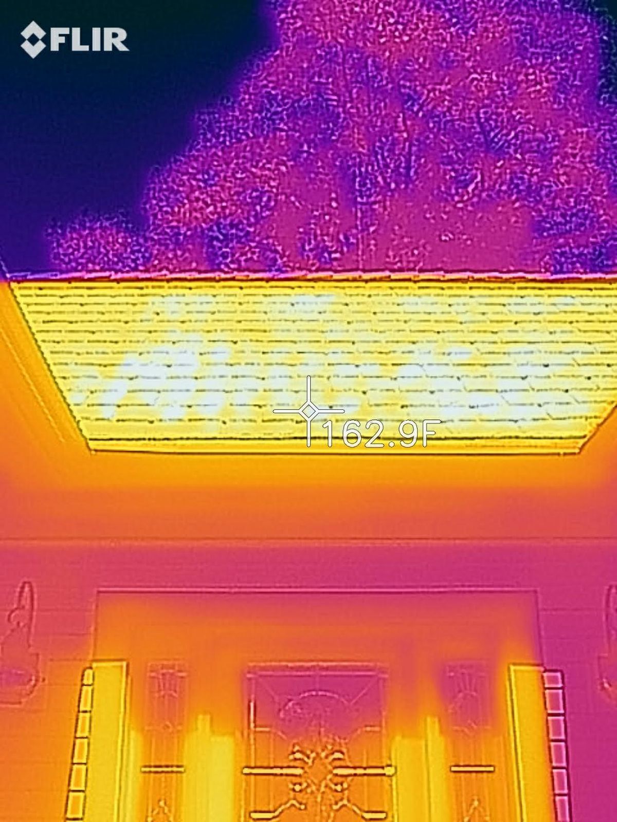 This is a FLIR infrared photo of my roof on an August day at noon. 162.9 F - no wonder attic spaces can reach temperatures of 150 F or more. (Tim Carter)