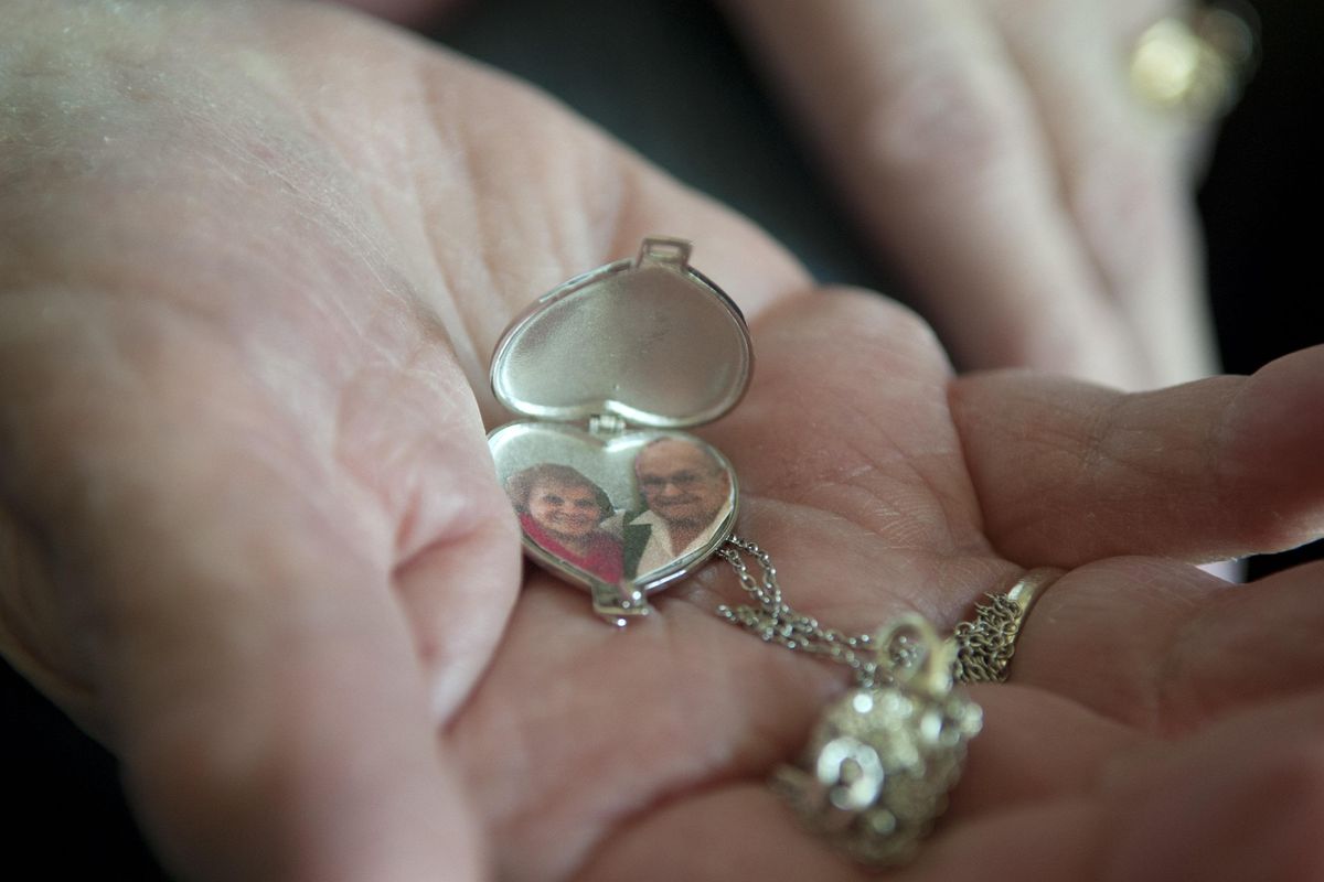 Donna Ottosen holds a locket her husband gave her at her home in Spokane Valley on Friday, March 22, 2019. The Ottosens celebrated their 69th wedding anniversary March 18. (Kathy Plonka / The Spokesman-Review)