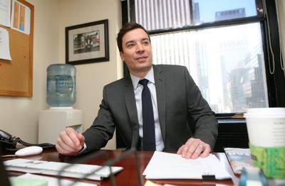 Jimmy Fallon debuts tonight  as host of NBC’s  “Late Night With Jimmy Fallon.” He posed for a photograph in his Rockefeller Center office Monday. (Associated Press / The Spokesman-Review)