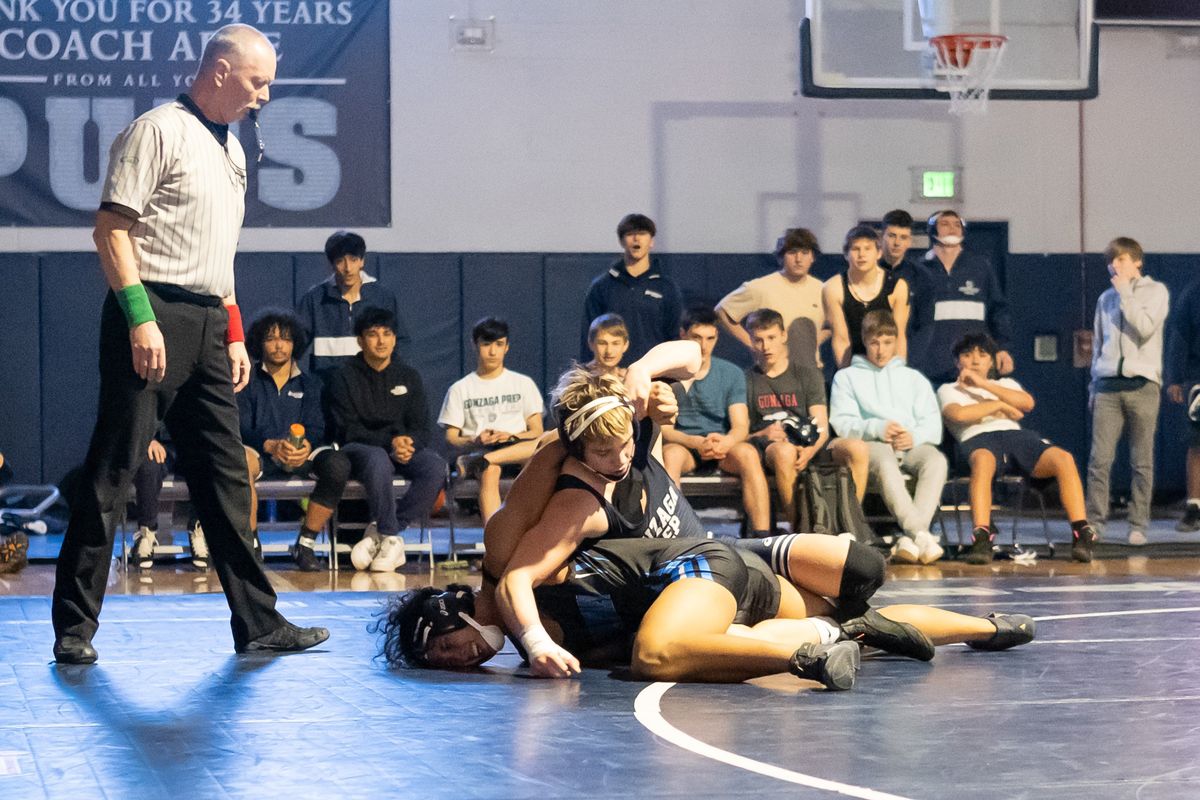 Gonzaga Prep’s Noah Holman, top, goes to pin Central Valley’s Ziah Boul during a Greater Spokane League dual on Thursday at Gonzaga Prep.  (Madison McCord/For The Spokesman-Review)