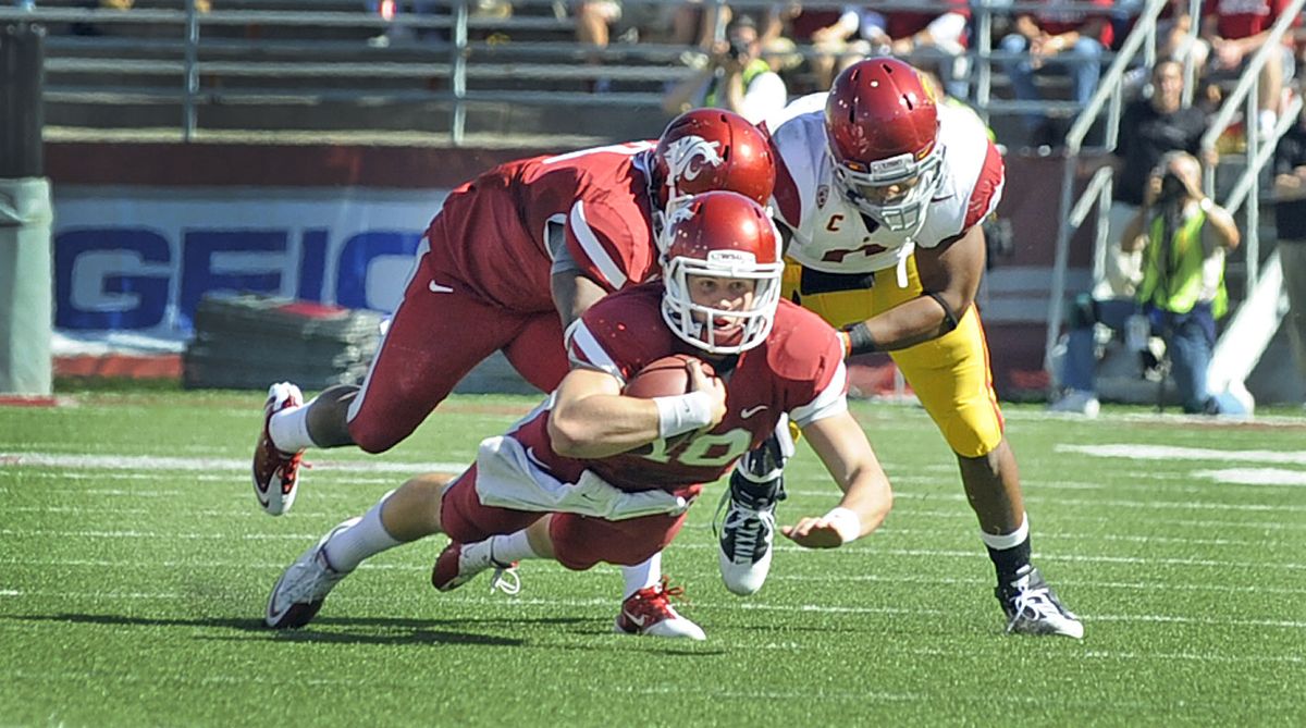 WSU quarterback Jeff Tuel dives for yardage aftr having to scramble out of the pocket against USC in Martin Stadium in Pullman Saturady September 25, 2010. (Christopher Anderson / Spokesman-Review)