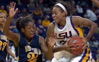 
LSU's Seimone Augustus, hauling down a rebound during an early January game, was the top selection in Wednesday's WNBA draft. 
 (Associated Press / The Spokesman-Review)