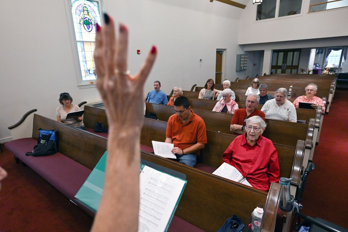 Albert Villa, center, and his grandmother, Jean Fratzke, right, during a practice for the Forgetful Friends Chorus on Oct. 7 in Springfield, Virginia. The chorus is for people with memory challenges and their caregivers. MUST CREDIT: Matt McClain/The Washington Post (Matt McClain/The Washington Post)