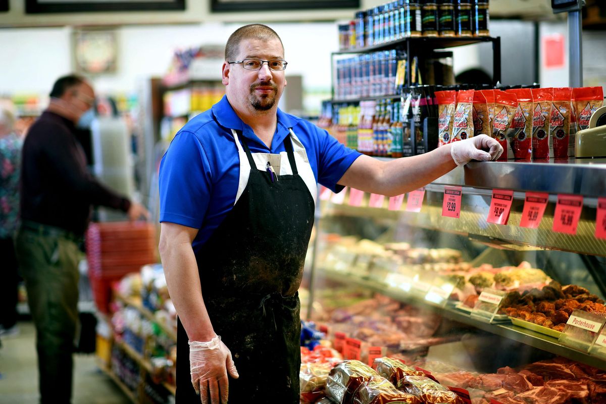 “I started working here when I was 17,” says Dan Englehart, meat manager for Sonnenberg’s Market & Deli in Spokane on Tuesday, April 7, 2020. The store has seen an increase in customers due to COVID-19. (Kathy Plonka / The Spokesman-Review)