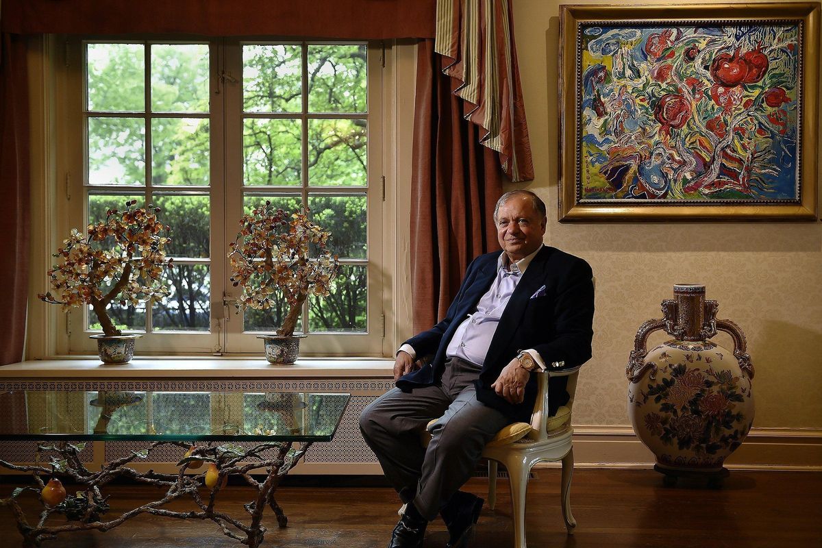 In this May 17, 2016, photo, Farhad Azima, the owner, chairman and chief executive officer of Kansas City-based Aviation Leasing Group poses for a photo at his home in Kansas City, Mo. The Associated Press has learned that the Iranian-born aviation mogul, described as holding a stay-out-of-jail card over his past work for the CIA, is the focus of a new global criminal corruption case. Authorities in the U.S. and abroad are investigating Azima as part of a global corruption case. Investigators are examining whether Azima, now 75, paid a kickback to a former United Arab Emirates official to reap the profits from a hotel sale in Tbilisi, Georgia. (Jill Toyoshiba / The Kansas City Star)