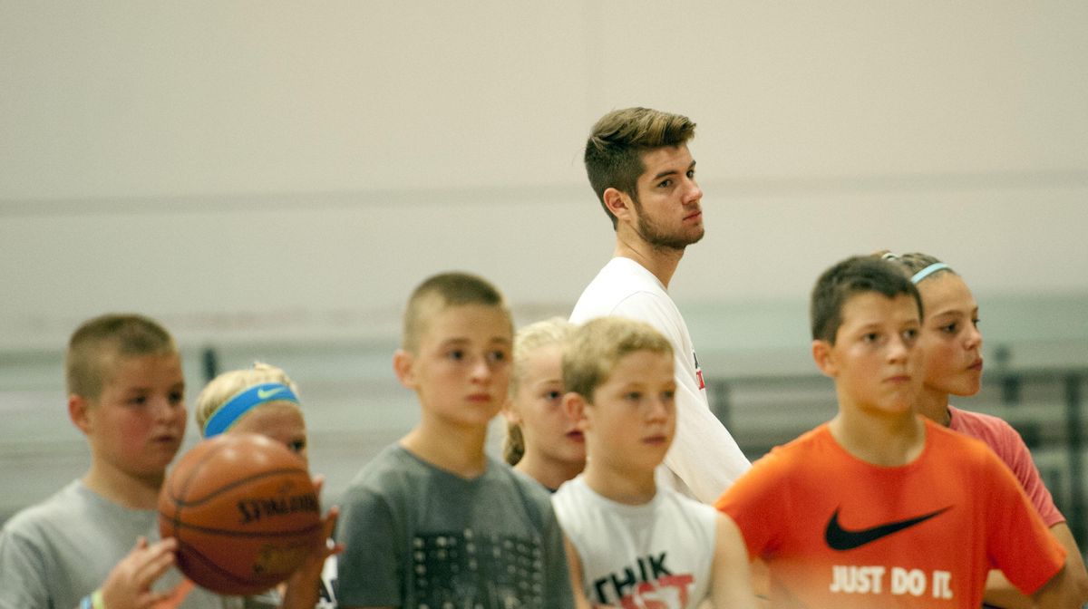 Gonzaga walk on Jack Beach is on hand to help with instruction during basketball camp run by Nigel Williams-Goss at The Hub in Liberty Lake on Tuesday, Aug. 22, 2017. (Kathy Plonka / The Spokesman-Review)
