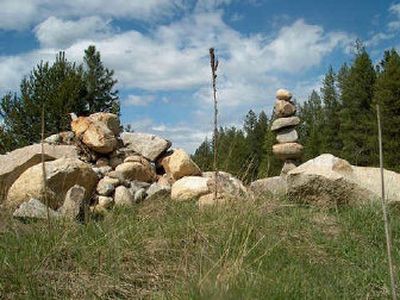 
Someone has been stacking rocks that were dumped at Farragut State Park from excavation sites last year. Vandals have knocked the piles over only for them to reappear. 
 (Courtesy of Herb Huseland / The Spokesman-Review)