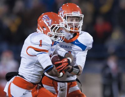 Running back Ridgeway Frank (1) and QB Brian Bell are key cogs in the Sam Houston State triple-option offense. (Associated Press)