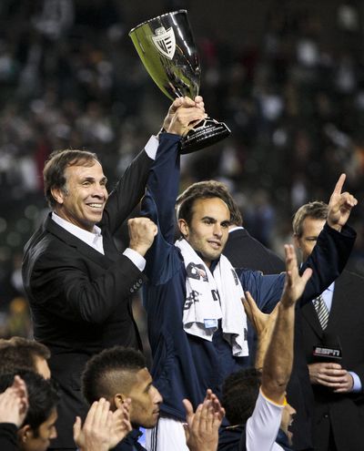Los Angeles head coach Bruce Arena, left, and Galaxy midfielder Landon Donovan celebrate after beating Real Salt Lake. (Associated Press)