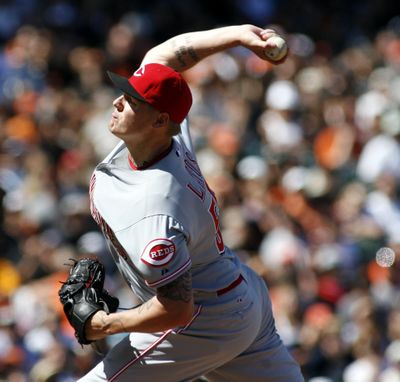 Cincinnati’s Mat Latos pitched a two-hitter in 2-1 win over San Francisco. (Associated Press)