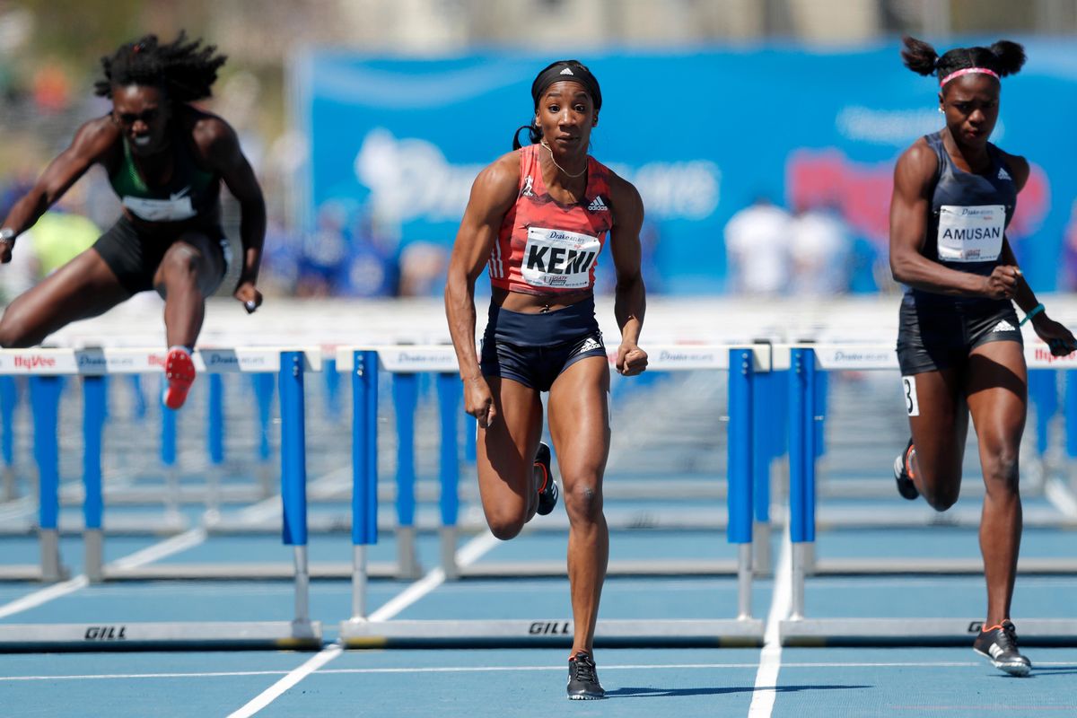 Kendra Harrison, center, races to the finish line ahead of Dawn Harper-Nelson, left, and Tobi Amusan, right, while winning the women’s elite 100-meter hurdles at the Drake Relays athletics meet, Saturday, April 28, 2018, in Des Moines, Iowa. (Charlie Neibergall / Associated Press)